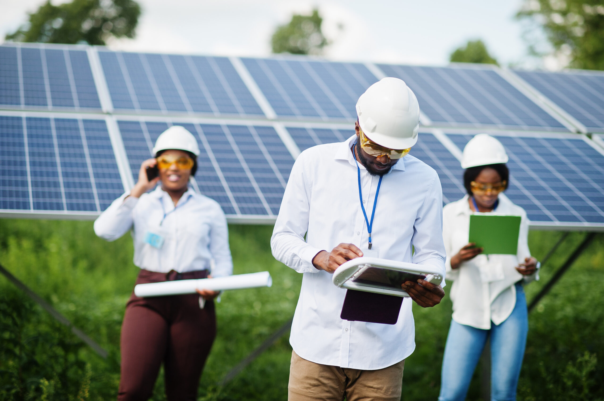 african american technician checks maintenance solar panels group three black engineers meeting solar station 1 scaled